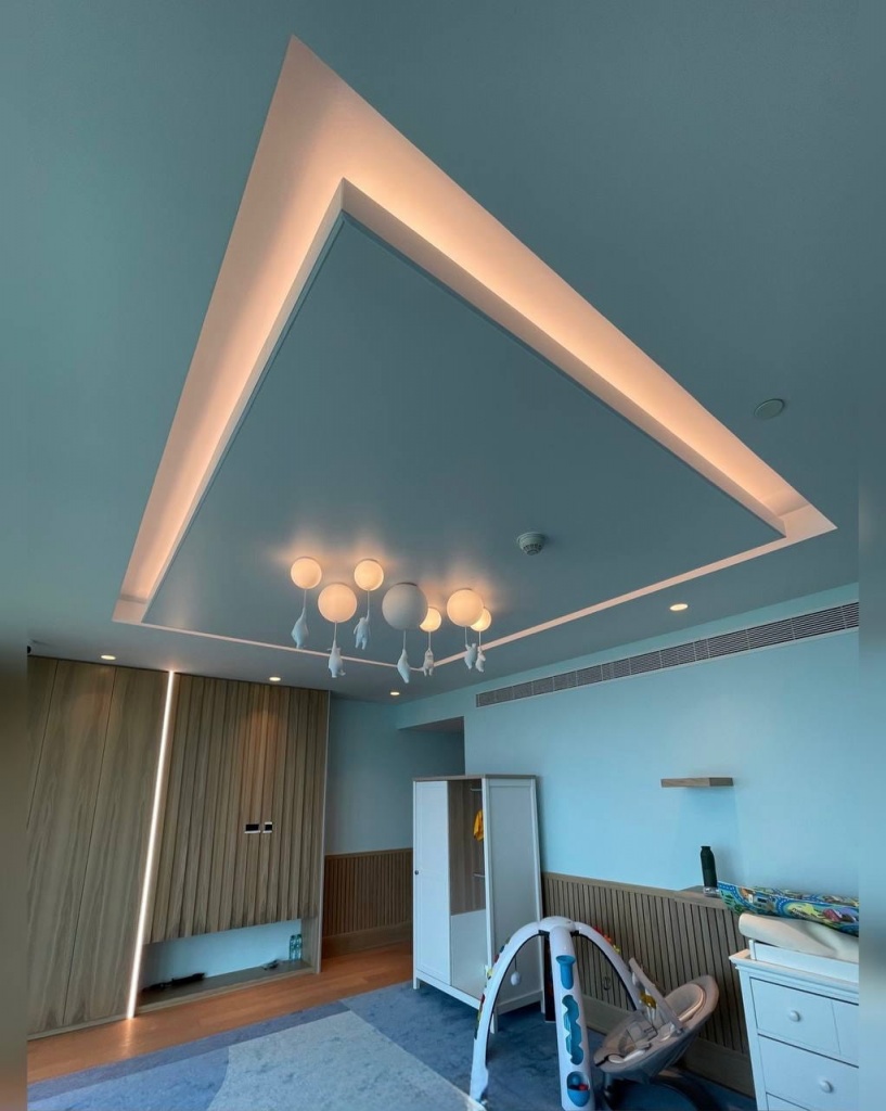 Minimalist floating stretch ceiling with hidden cove lighting designed for a premium children’s bedroom in Dubai. Minimalist floating stretch ceiling with hidden cove lighting designed for a premium children’s bedroom in Dubai.