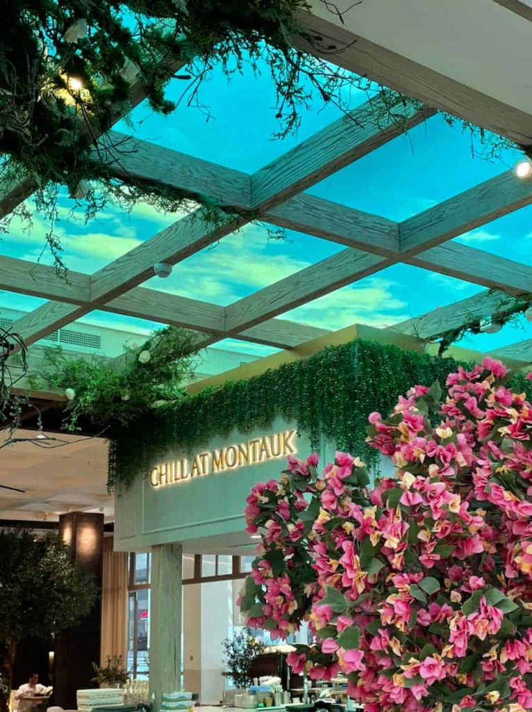 Custom illuminated sky ceiling installed above a café, creating the feeling of dining beneath an open blue sky. Custom illuminated sky ceiling installed above a café, creating the feeling of dining beneath an open blue sky.