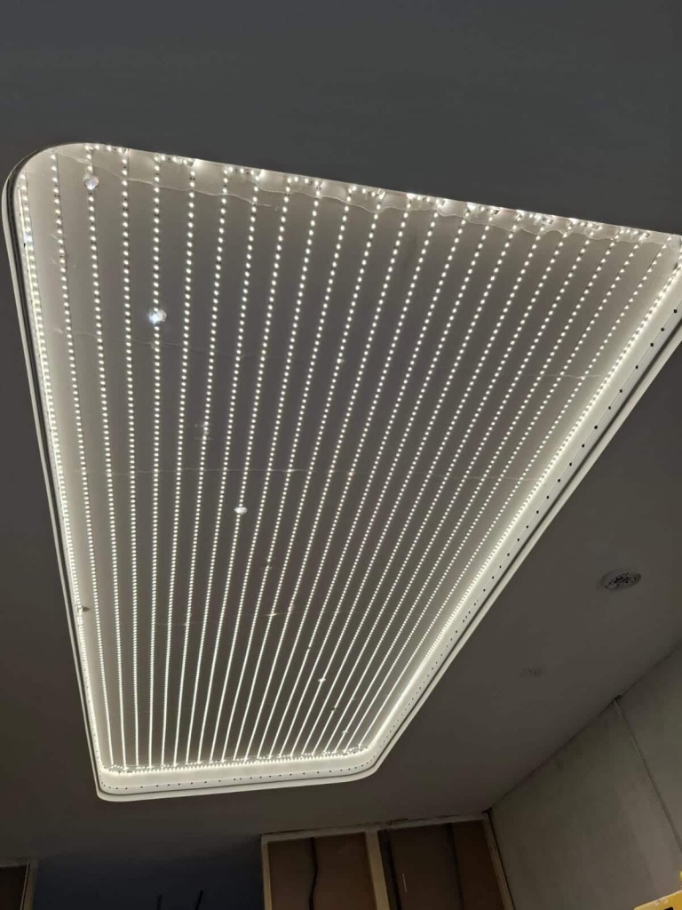 Stretch ceiling LED installation in Dubai – precise placement of LED strips for uniform backlit ceiling illumination Stretch ceiling LED installation in Dubai – precise placement of LED strips for uniform backlit ceiling illumination