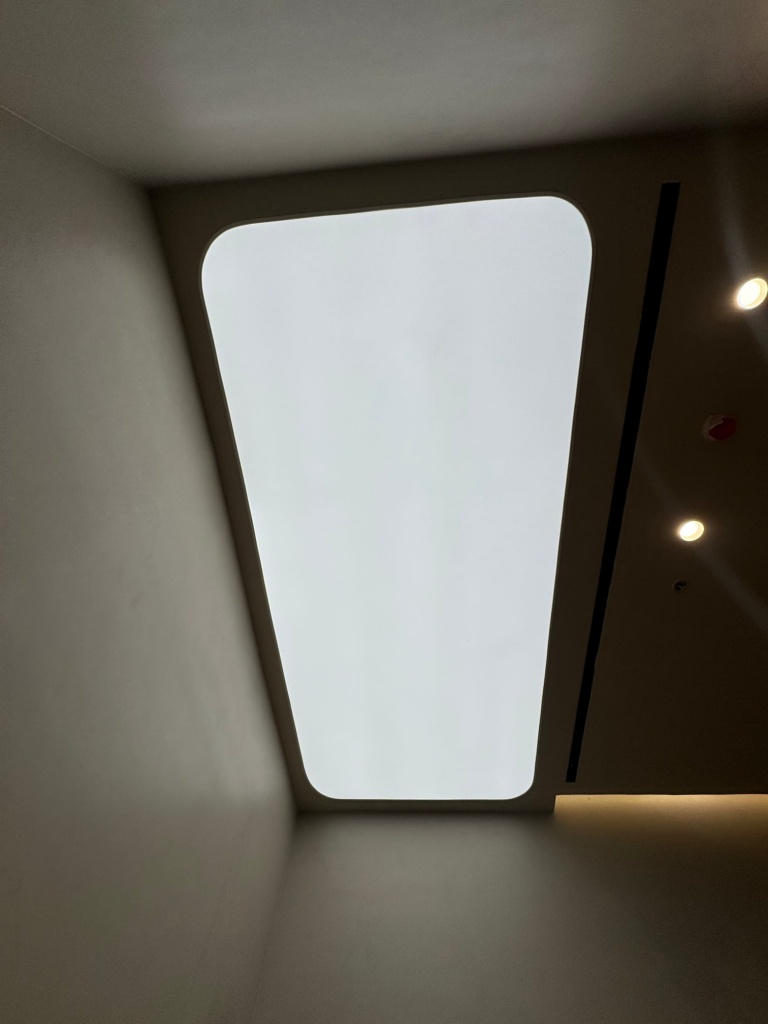 Custom rounded rectangular translucent stretch ceiling designed to create a clean and evenly illuminated architectural light feature. Custom rounded rectangular translucent stretch ceiling designed to create a clean and evenly illuminated architectural light feature.