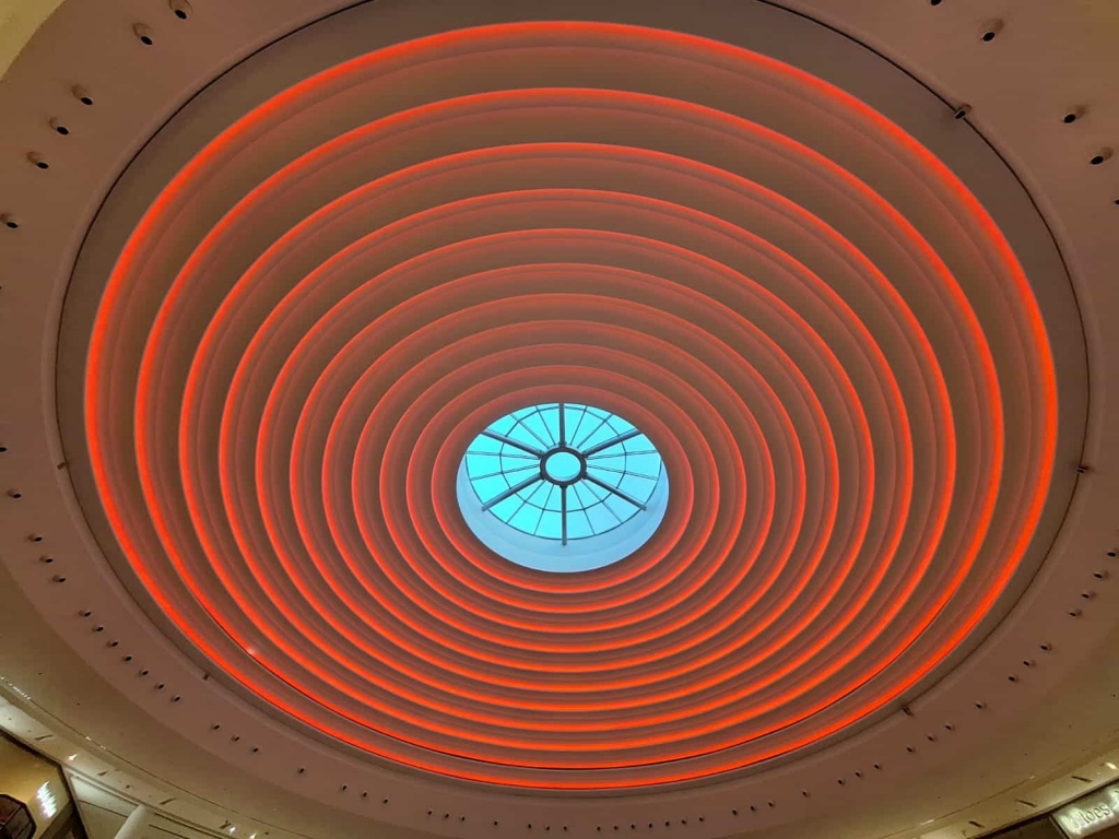 Large circular RGBW architectural ceiling featuring concentric illuminated rings with programmable colour-changing LED lighting. Large circular RGBW architectural ceiling featuring concentric illuminated rings with programmable colour-changing LED lighting.