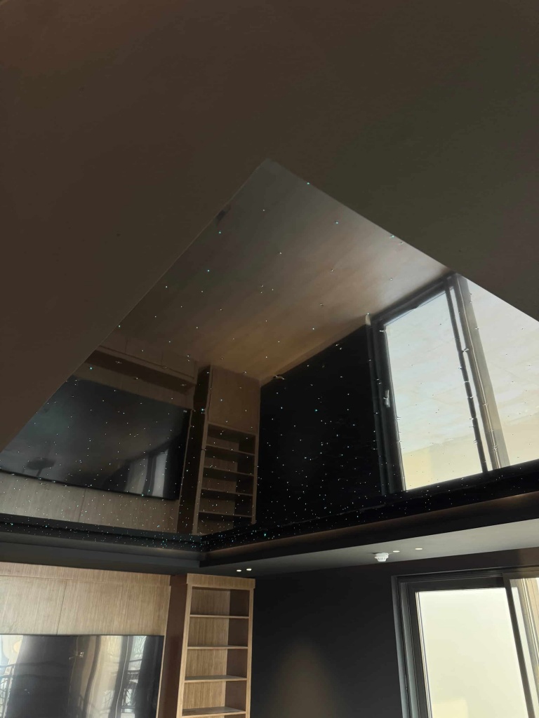 Custom-designed black glossy ceiling featuring hundreds of fiber optic stars installed in an Abu Dhabi villa. Custom-designed black glossy ceiling featuring hundreds of fiber optic stars installed in an Abu Dhabi villa.