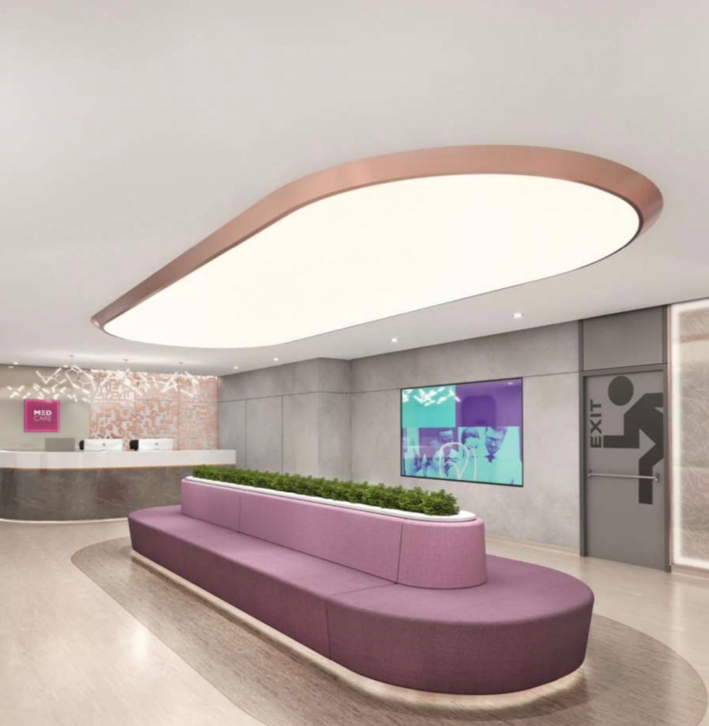 Custom shape stretch ceiling light box with 4000K LED lighting installed in a hospital entrance in Festival City Mall, Dubai. Stretch ceiling Dubai solution with uniform hospital lighting.