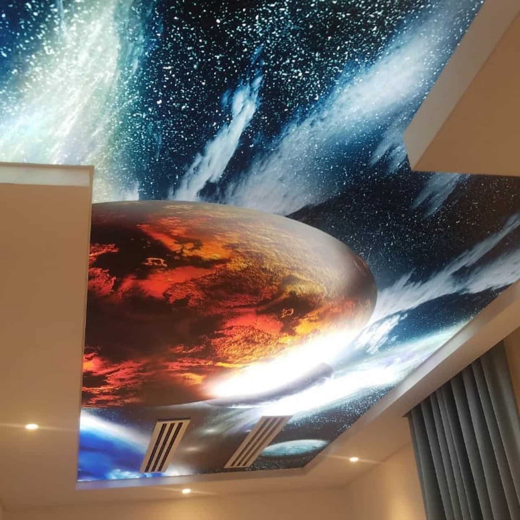 Galaxy printed stretch ceiling featuring stars, nebulae, and dramatic cosmic artwork installed in a luxury Dubai villa. Galaxy printed stretch ceiling featuring stars, nebulae, and dramatic cosmic artwork installed in a luxury Dubai villa.