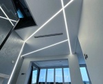 White Stretch Ceiling with Linear Lights Installation in Dubai