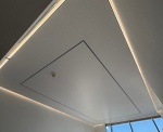 White Stretch Ceiling with Perimeter LED Lighting and Magnetic Track Lights in a Dubai Villa